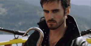 Brooding pirate with metal hook and leather jacket
