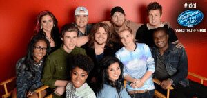 Group photo of American Idol contestants smiling.