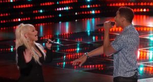 Singers performing together on stage.