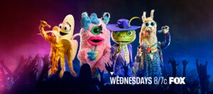 Colorful puppets performing in front of an audience.