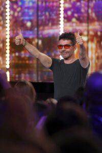 Simon Cowell gives AGT audience members two thumbs up during the Season 19 Judges Auditions. (Photo property of NBC's Trae Patton)
