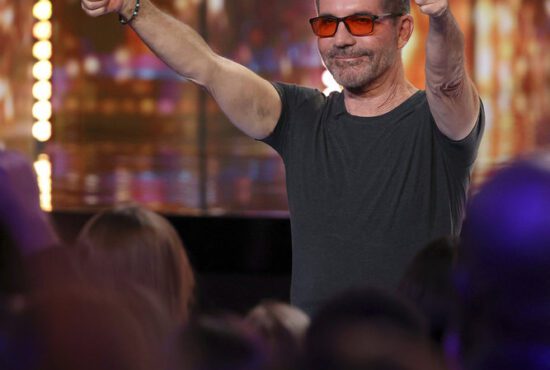 Simon Cowell gives AGT audience members two thumbs up during the Season 19 Judges Auditions. (Photo property of NBC's Trae Patton)